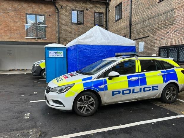 Police outside the flat in Bushey