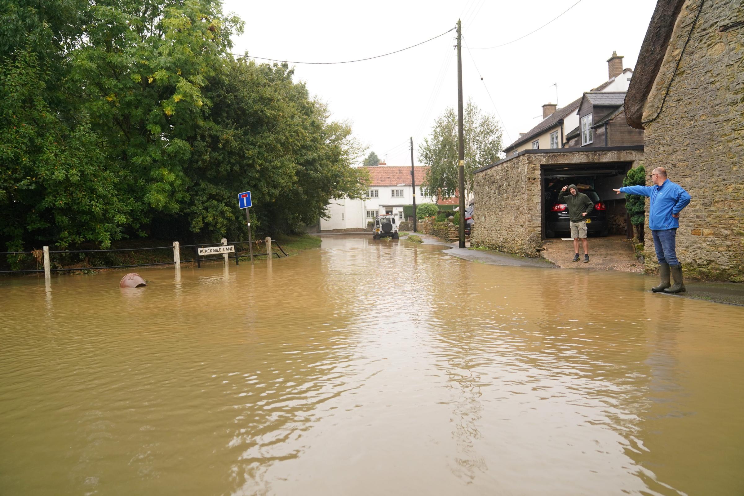 Flash floods hit parts of Britain as month’s worth of rain to fall in 24 hours